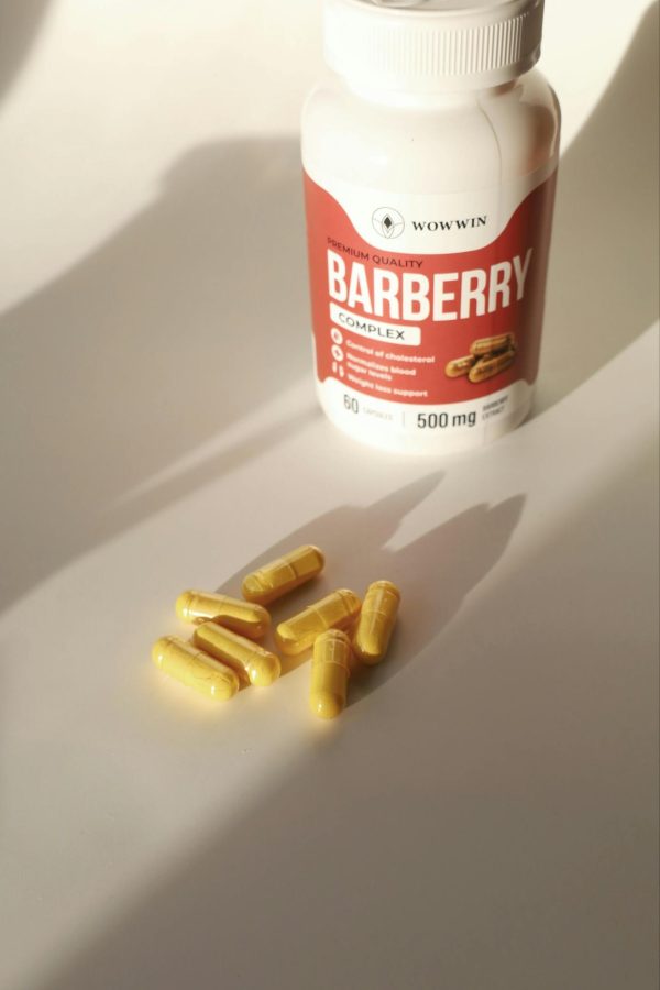 High-quality Barberry Complex supplement bottle alongside capsules in soft lighting.